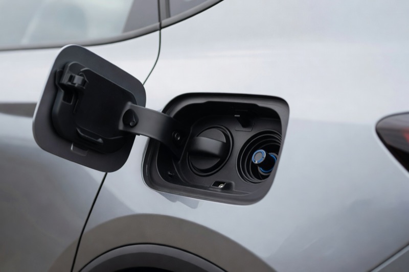 A filler cap beside the fuel filler on a modern diesel car