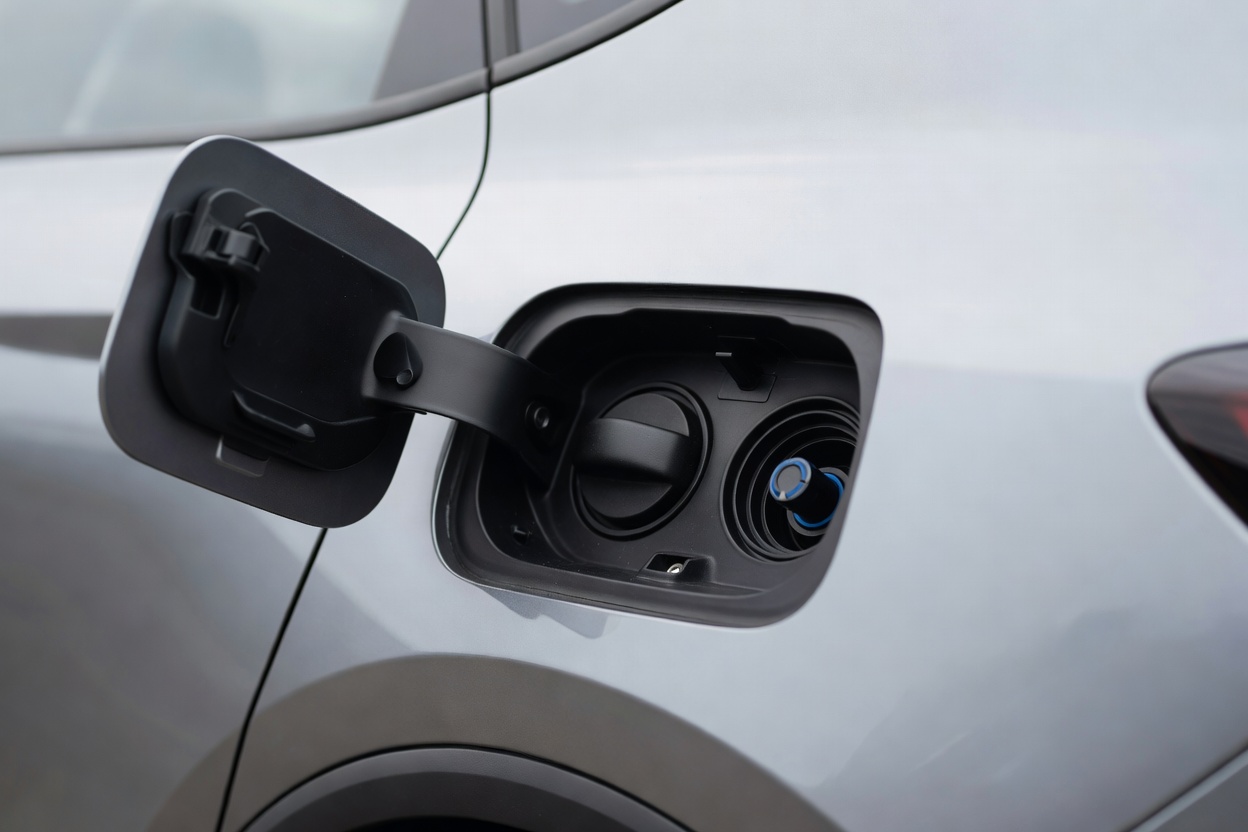 A filler cap beside the fuel filler on a modern diesel car